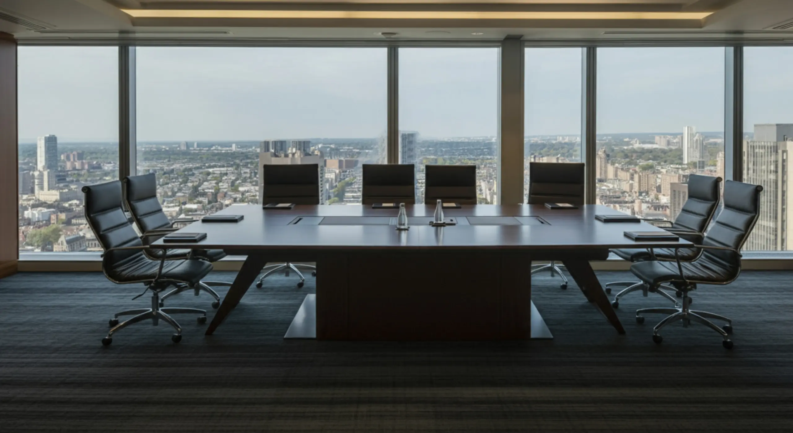 Modern corporate boardroom with panoramic city view