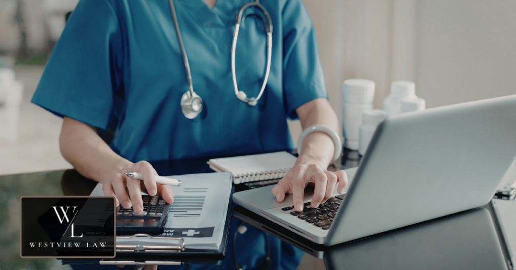 Employee reviewing medical records and work documents for discrimination case