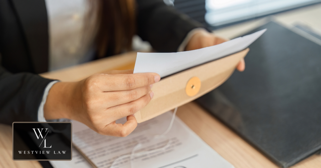 Employee reviewing an employment contract and company policies after termination