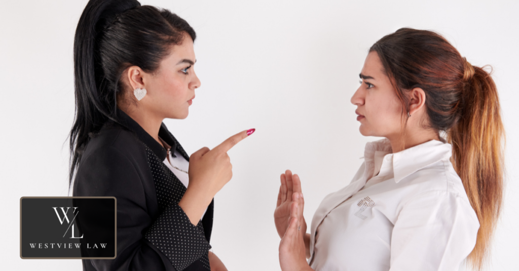 Common Reasons for Termination During FMLA Leave Workplace confrontation between two employees, illustrating common reasons for termination during FMLA leave