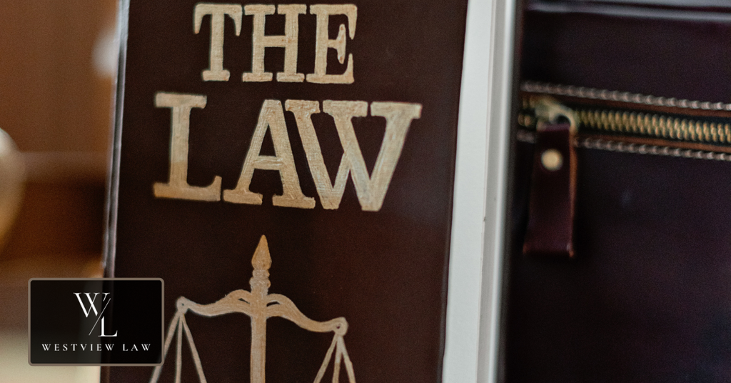 Law book with scales of justice representing legal protections against workplace retaliation.
