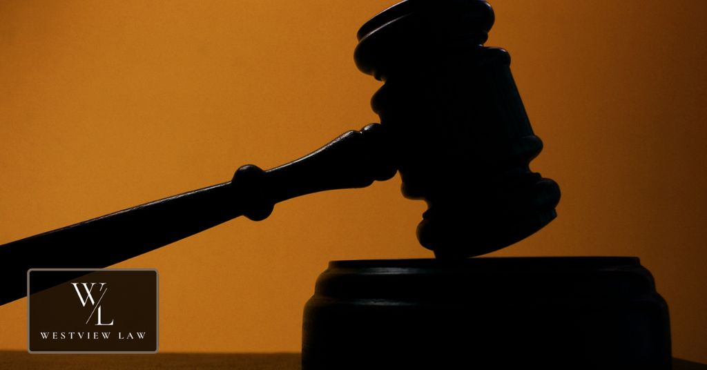Judge’s gavel representing legal action against an employer in California.