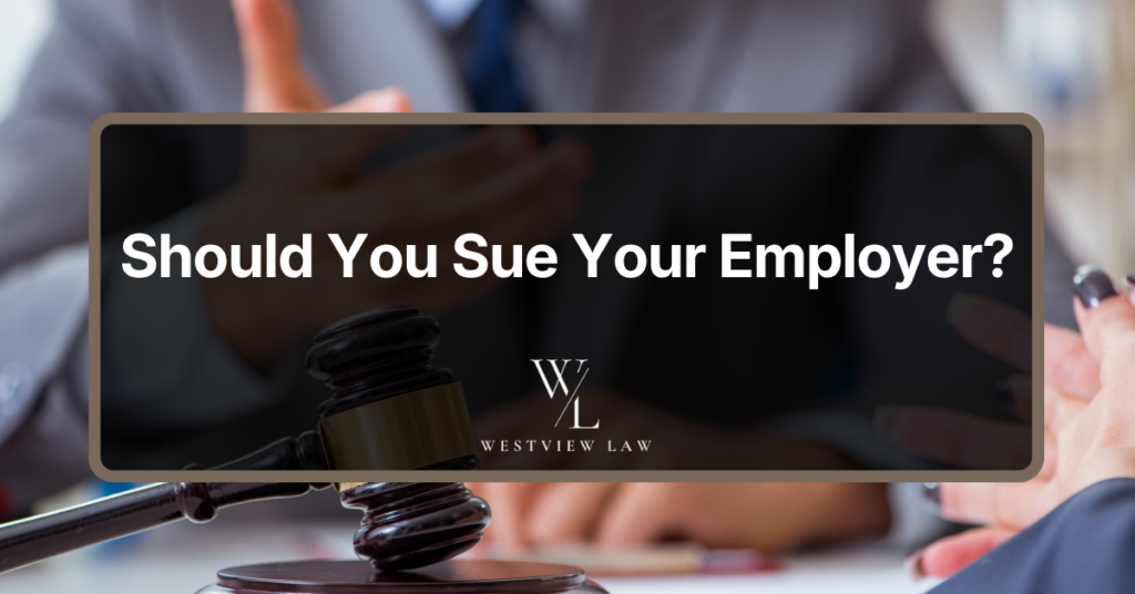 Employment law consultation with a judge’s gavel representing a potential lawsuit against an employer.