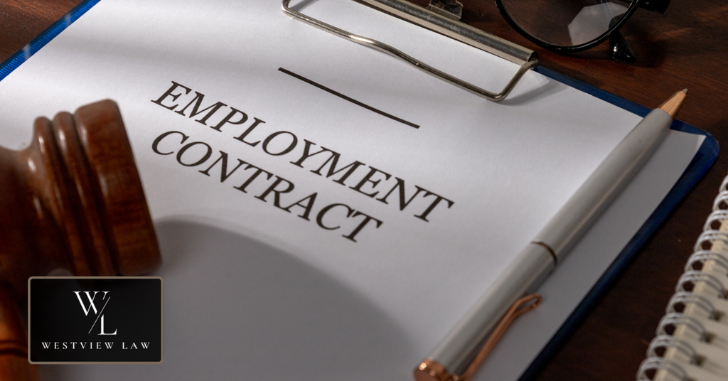 Employment contract document with a judge’s gavel representing employment agreements and workers’ legal rights.